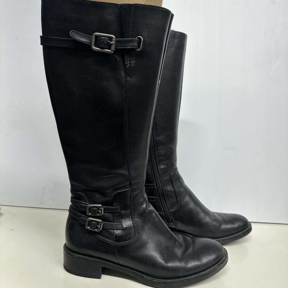 Black leather knee-high riding boots